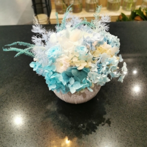 little cut pot preserved dry flowers arranged