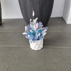 blue colour preserved flowers arranged